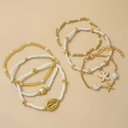 Elegant Gold & Pearl Bracelet Set